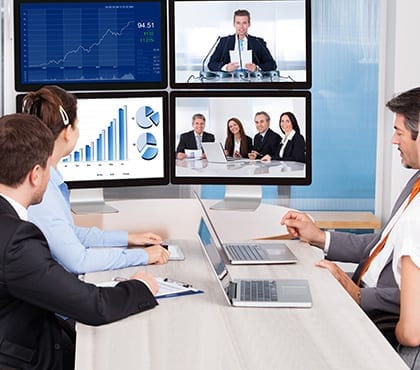 employees video conferencing with others to discuss data security