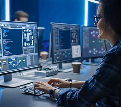 woman working on computer that is protected through a disaster recovery plan